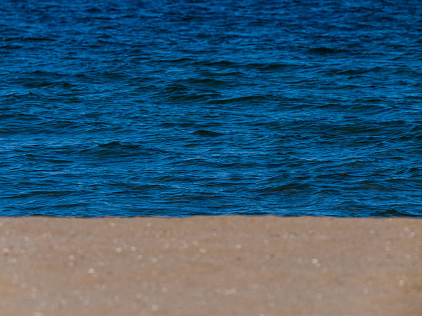 Sandy beach and beautiful blue waves
