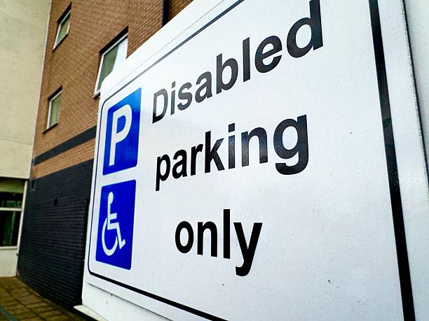 istock A disabled parking only sign against a building exterior 2228685582