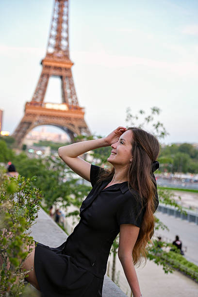 istock Smiling woman enjoying Eiffel Tower view in Paris 2228688130