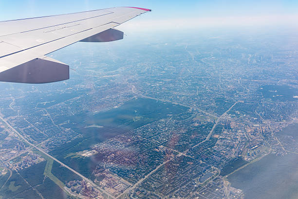 istock View from the airplane window at a beautiful cloudy sky and the airplane wing 2228690874