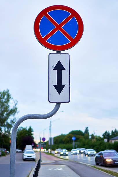 istock No Parking Close-Up Sign and evening traffic 2228691300