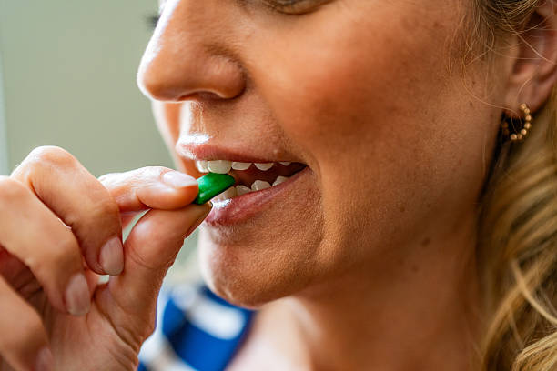 istock Close-up woman taking medicine 2228691571