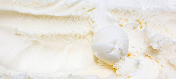 istock Ice cream scoop, taking out vanilla ice cream close-up. 2228691778