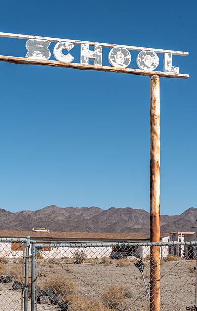 istock Sign at abandoned school 2228692284