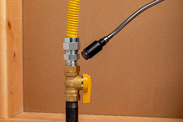 istock Checking natural gas or propane fitting with leak detector. 2228692318