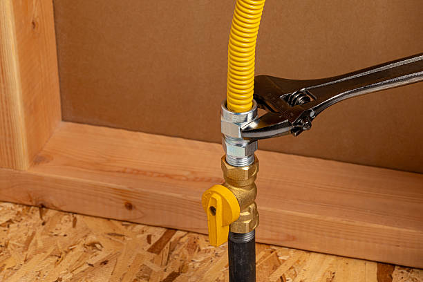 Installing natural gas or propane flexible line.