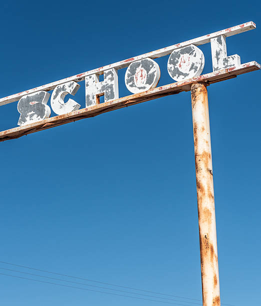 istock Sign at abandoned school 2228692405