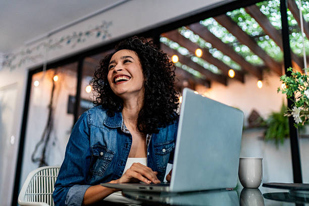 istock Young woman using laptop and contemplating at home 2228692862