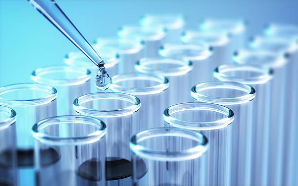 3d render Testing Liquid from Glass Pipette to Test Tubes on Blue Reflective Background, Laboratory and Medical Concept (Depth Of Field)