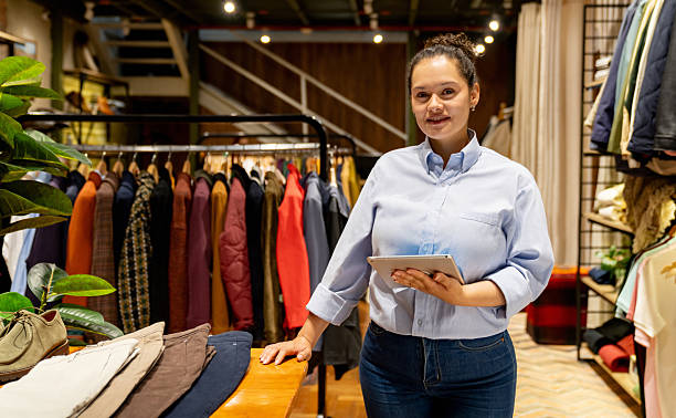 istock Retail clerk working at a clothing store 2228695369