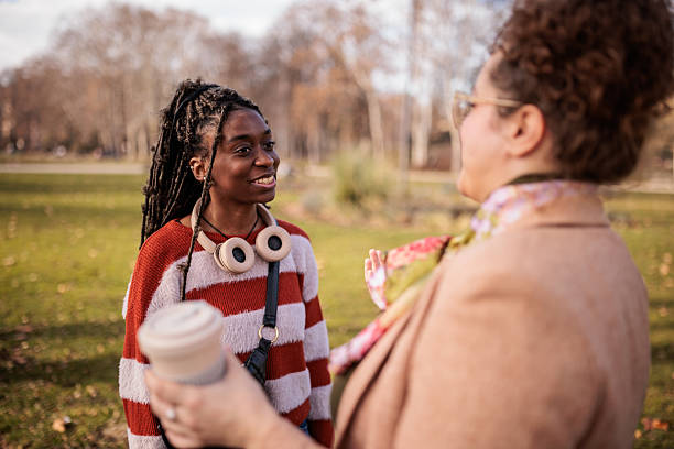 istock Female Friends Chatting in a Public Park 2228698940