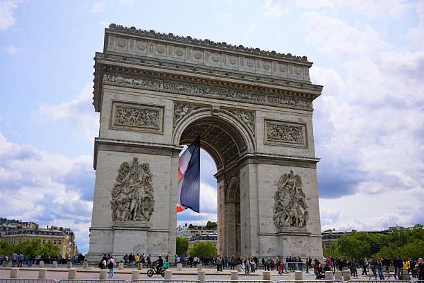 Editorial image of French flag hanging beneath Arc de Triomphe in Paris France on June 4 2025 during public event