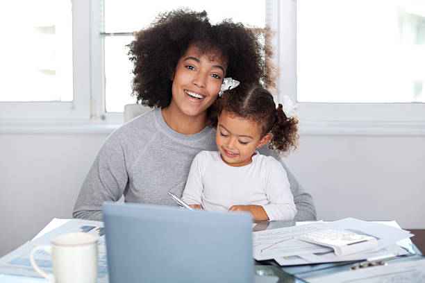 istock Young mother working and spending time with her daughter 2228699345