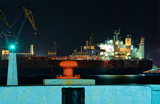 Cargo terminal at the port of Brindisi with container ships waiting to leave, Brindisi, Puglia, Italy