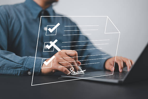 istock Electronic Signature Concept, Electronic Signing Businessman signs electronic documents on digital documents on virtual laptop screen using pen. 2228701293