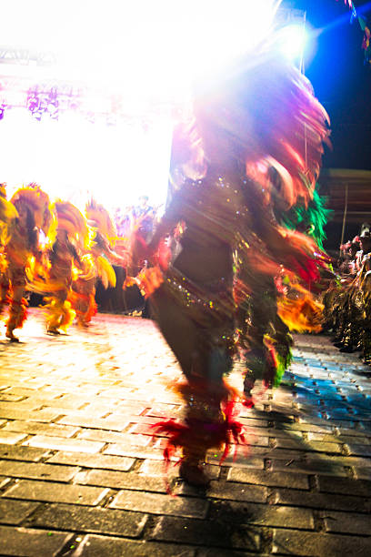 People celebrating and dancing brazilian carnival at school carnival