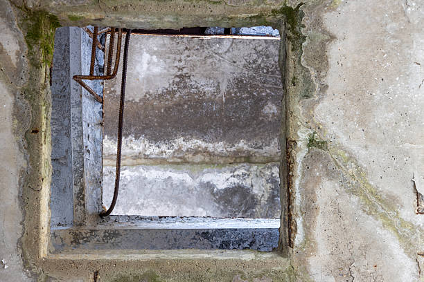 Hole from an rooftop door in a damaged panel house