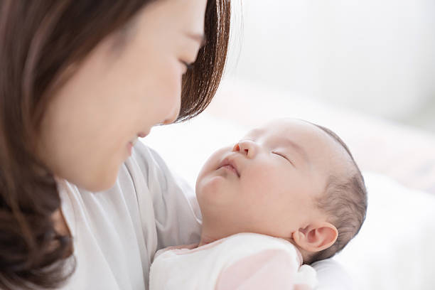 istock asian mother and baby 2228712477