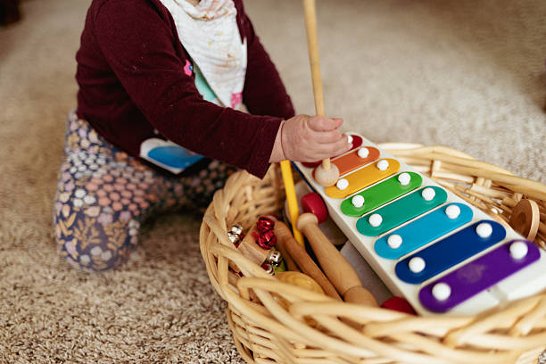 istock Toddler playing with musical instruments at home 2228716458