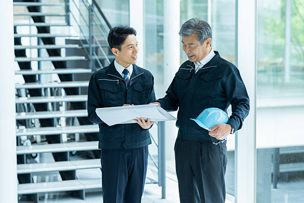 istock Businessmen in work clothes having a meeting 2228721687