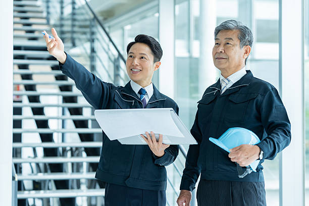istock Businessmen in work clothes having a meeting 2228721691