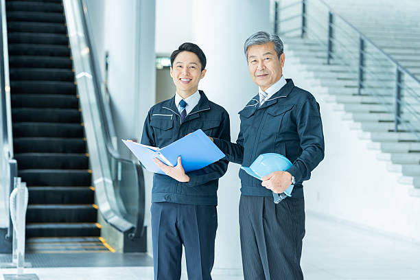 istock Businessmen in work clothes having a meeting 2228721697