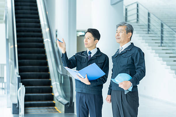 istock Businessmen in work clothes having a meeting 2228721698