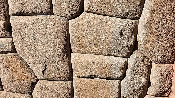 Antique stone wall at archaeological site of Cusco City in Peru at daylight