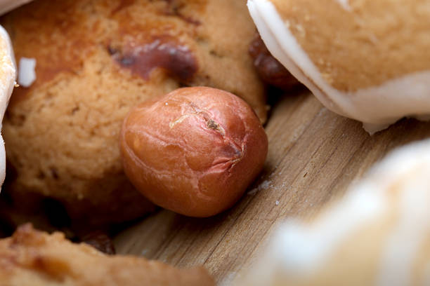 A close-up of a rustic tray with baked goods and nuts.