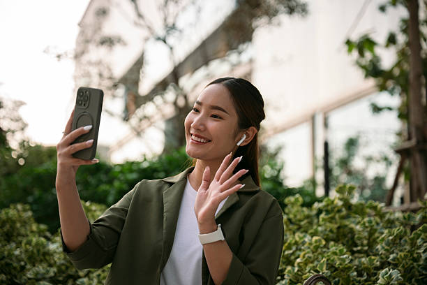 istock Young asian woman making a video call on her smartphone 2228731279