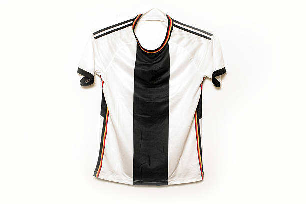 Soccer T-shirt is hanging on isolated white background