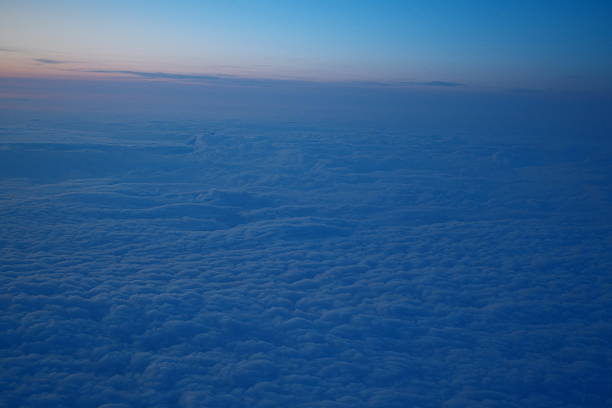 up in the air - aerial view on a plane during a sunset