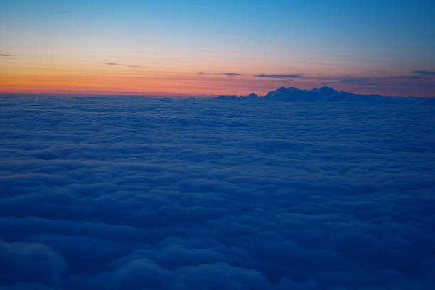 up in the air - aerial view on a plane during a sunset