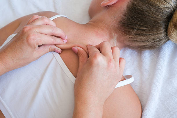 istock A woman gives a back massage to a child. 2228735363