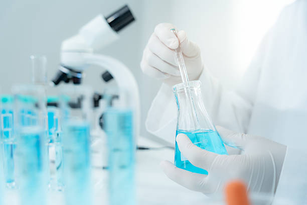 istock Scientist analyze biochemical samples in advanced scientific laboratory. Medical are mixing chemicals to test physical properties of cosmetic. develop viral. Biotechnology research in science lab. 2228737376