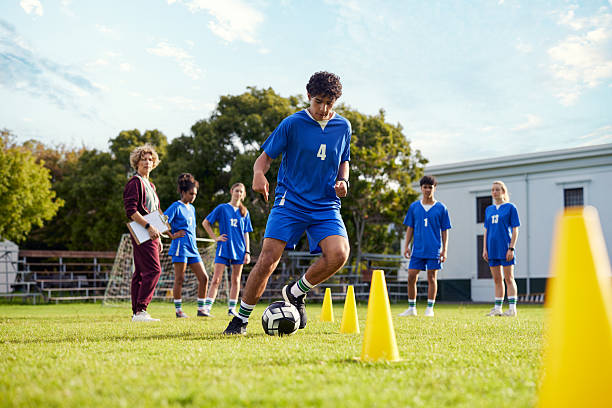 istock Football drill training at high school campus 2228740185