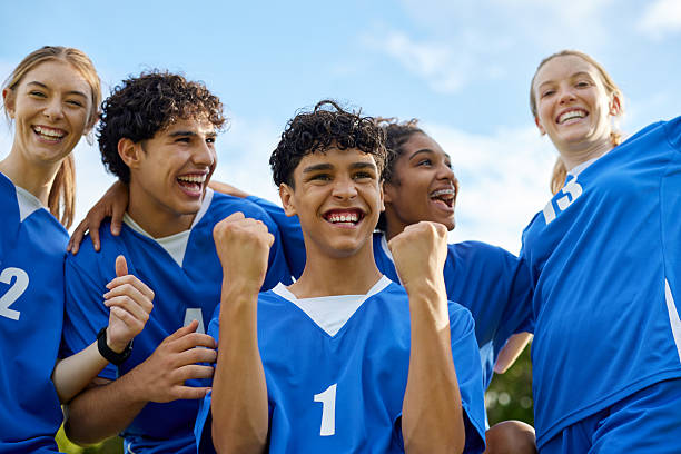 istock Football team celebrating a goal during a match 2228740274