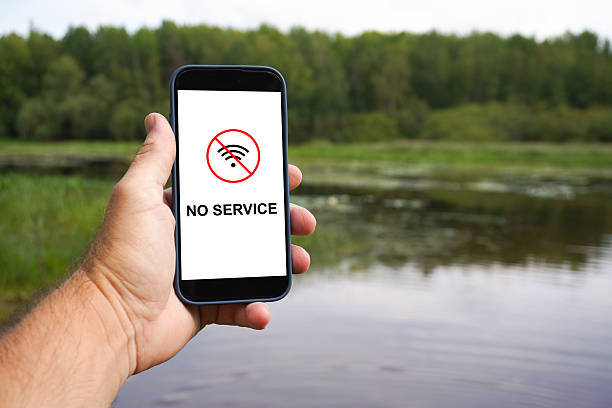 istock Hand holding smartphone with no service in nature reserve 2228740482