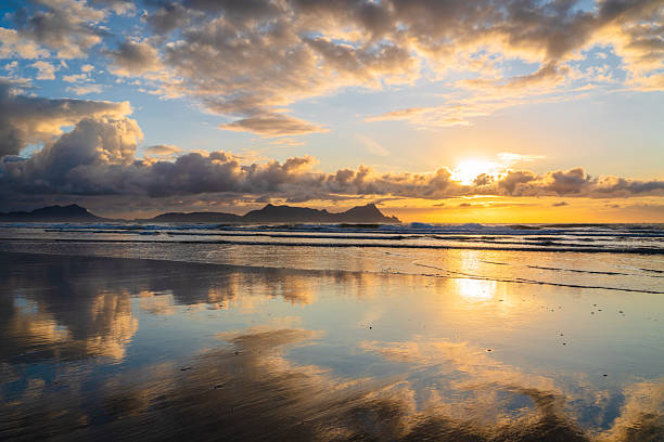 istock Sunset sky in sea's mirror at golden hour. 2228741760