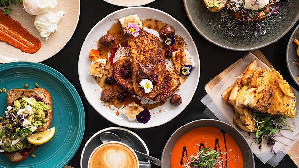 istock Gourmet food spread on table, family style dinner table. 2228743160