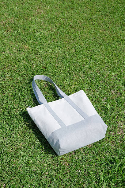istock Mockup shopper handbag on green grass background 2228747198