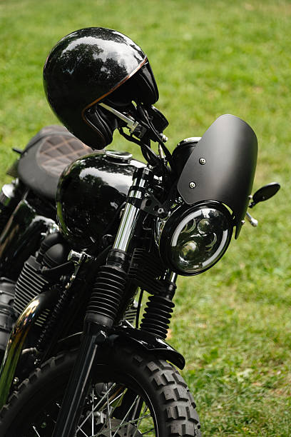 istock Stylish and sleek Black Motorcycle with Helmet, fully equipped and ready for a thrilling Adventure 2228749826