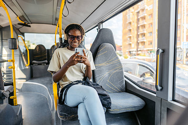 istock Young Black Woman Using Her Phone While Riding A Bus 2228750207