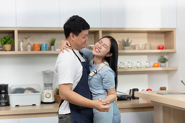 istock Couple Cooking Together in Modern Kitchen, Sharing Joyful Moments 2228752772