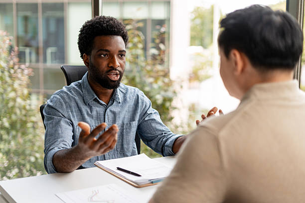istock Two businessmen discussing during a meeting in the office 2228752828