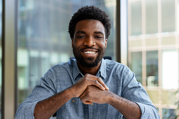 istock Smiling Young Adult Man in Office Setting 2228752914