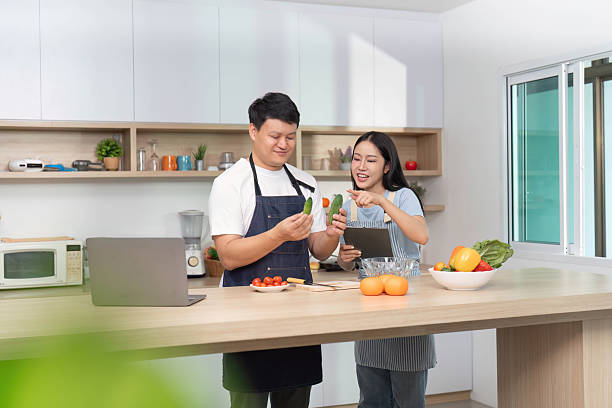 istock Healthy Cooking Together: Couple Preparing Fresh Vegetables in Modern Kitchen 2228753020