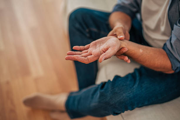 istock Man suffering from wrist pain, checking pulse and blood pressure 2228754818