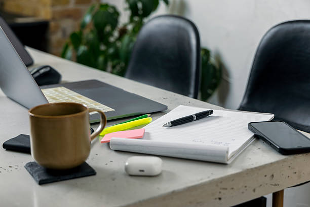 istock Modern Workspace with Coffee and Notebook on a Clean Desk 2228758484