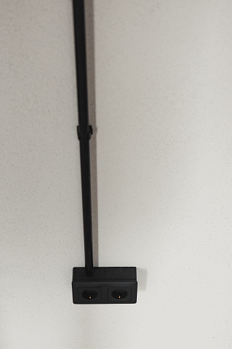 Wall Socket In Ceiling Electrical Sockets Hanging From Ceiling With Black Conduit Stock Photo ...